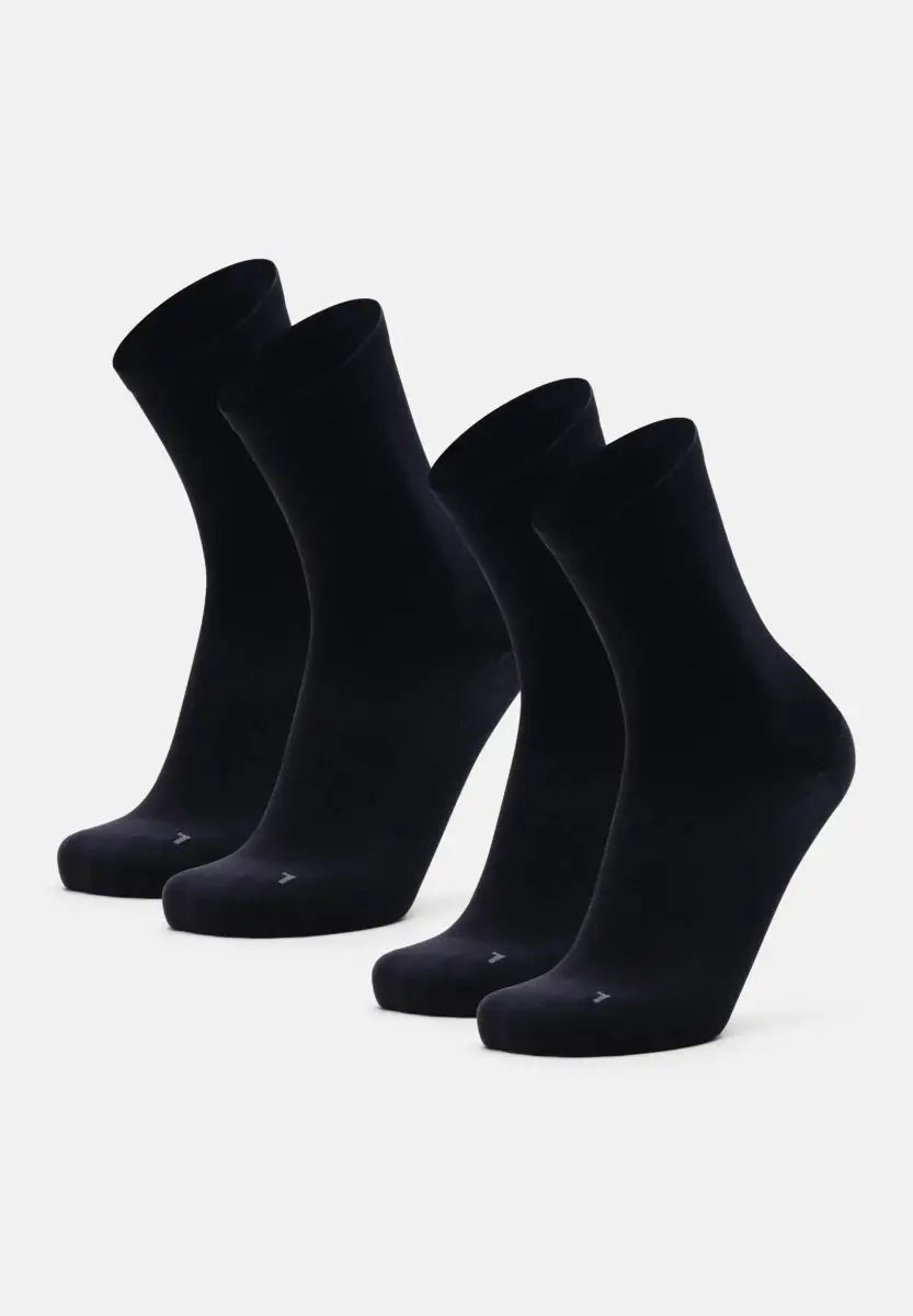 Two pairs of black plantar fasciitis socks, displayed upright on a white background.
