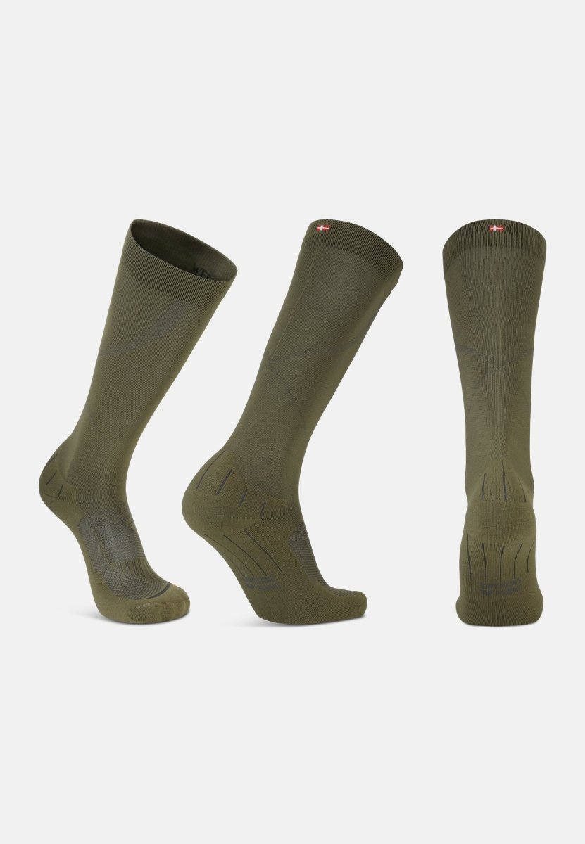 Three olive green compression socks, displayed front, side, and back, showing length and texture.