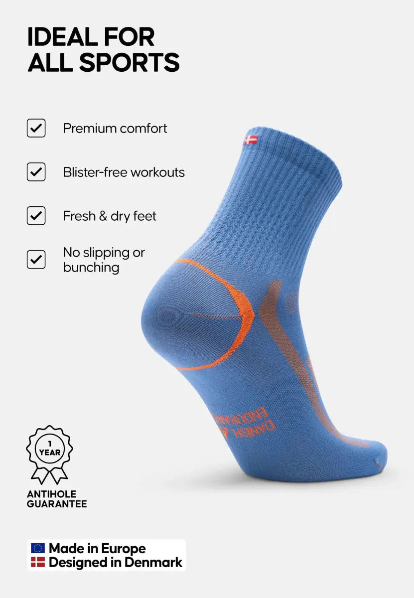 Blue sports sock with orange accents, features comfort, blister-free, anti-slip, European made.