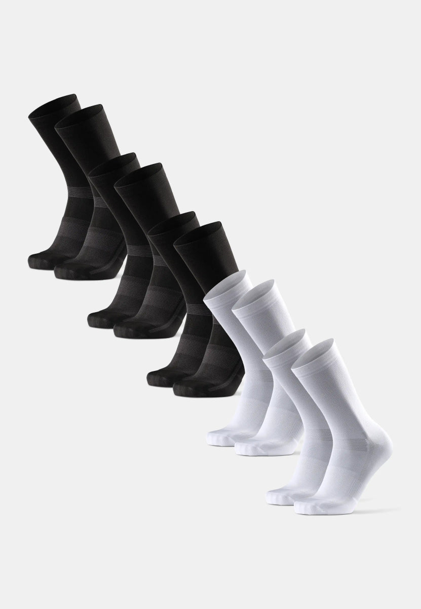 Black and white cycling socks displayed in two rows on a white background.