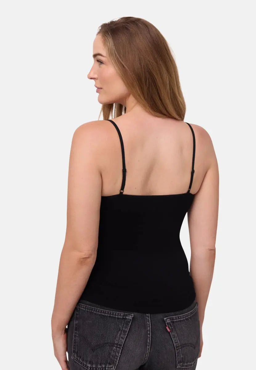 Person wearing a black seamless bamboo singlet top with thin straps, viewed from the back.