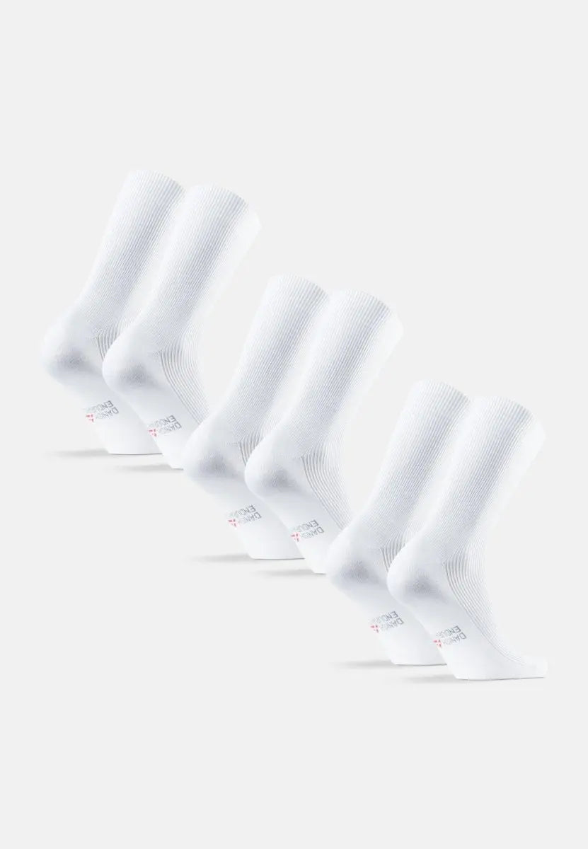 Four pairs of white ribbed crew socks arranged in a row on a light gray background.
