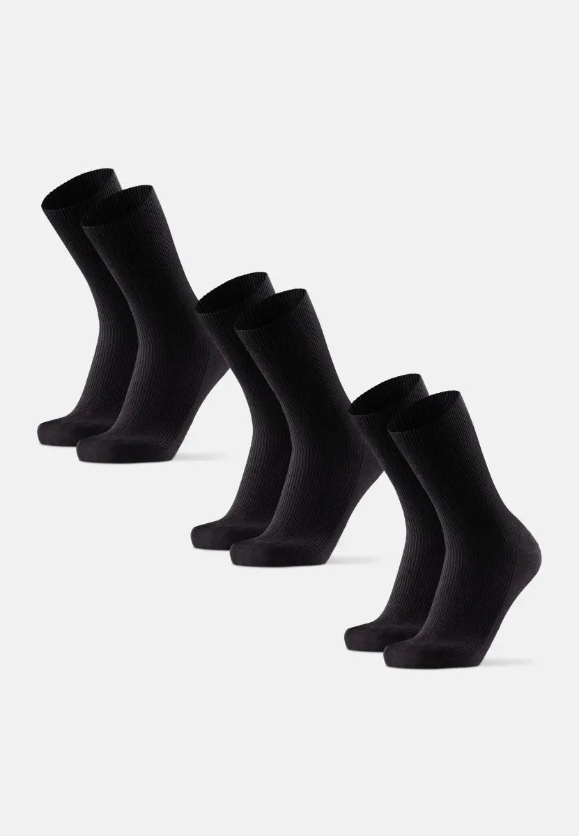 Five pairs of black soft top crew socks arranged in a row on a light background.