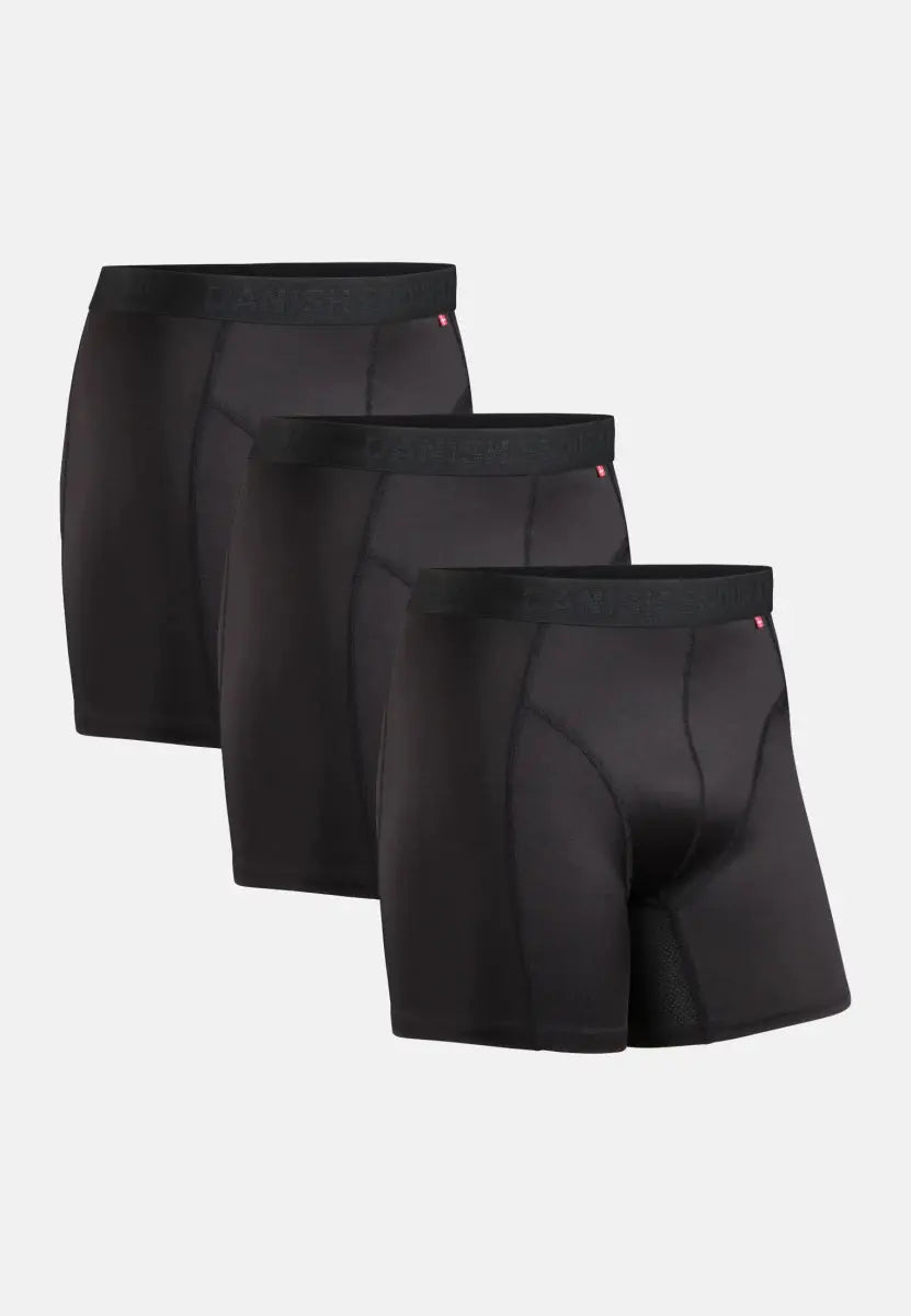 Three black sports boxer shorts with elastic waistbands, shown in a staggered arrangement.