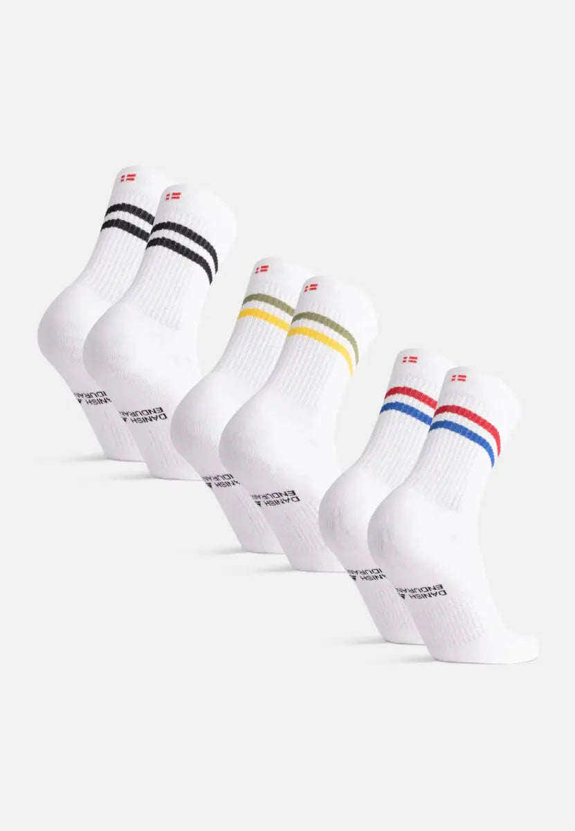 Five pairs of white socks with colored stripes: black, yellow, green, blue, and red.