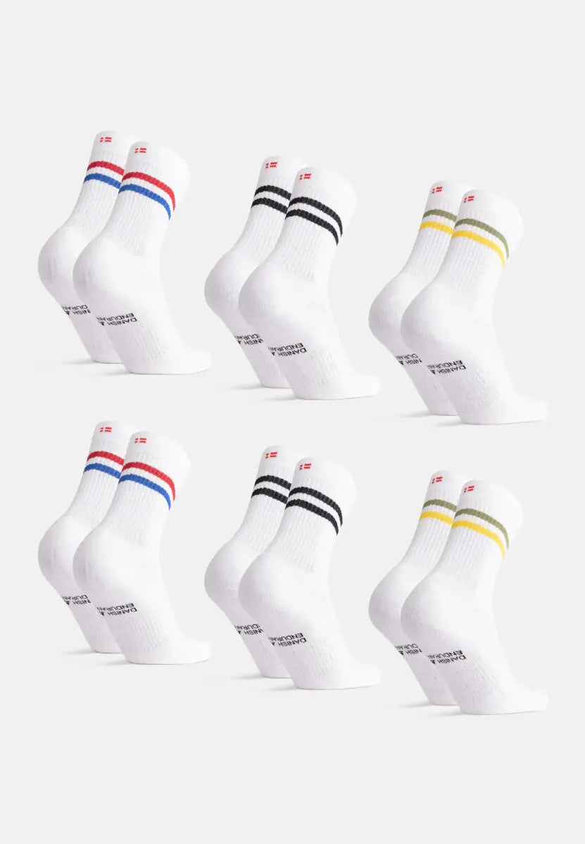 Six pairs of white socks with blue/red, black, and yellow/green stripes on a white background.