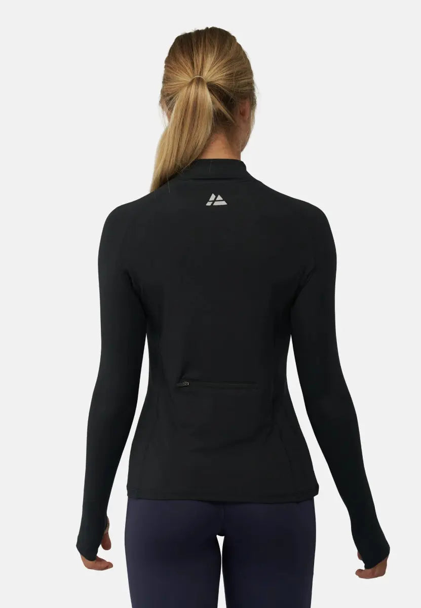 Back view of woman in black long sleeve athletic shirt with logo and zipper pocket.