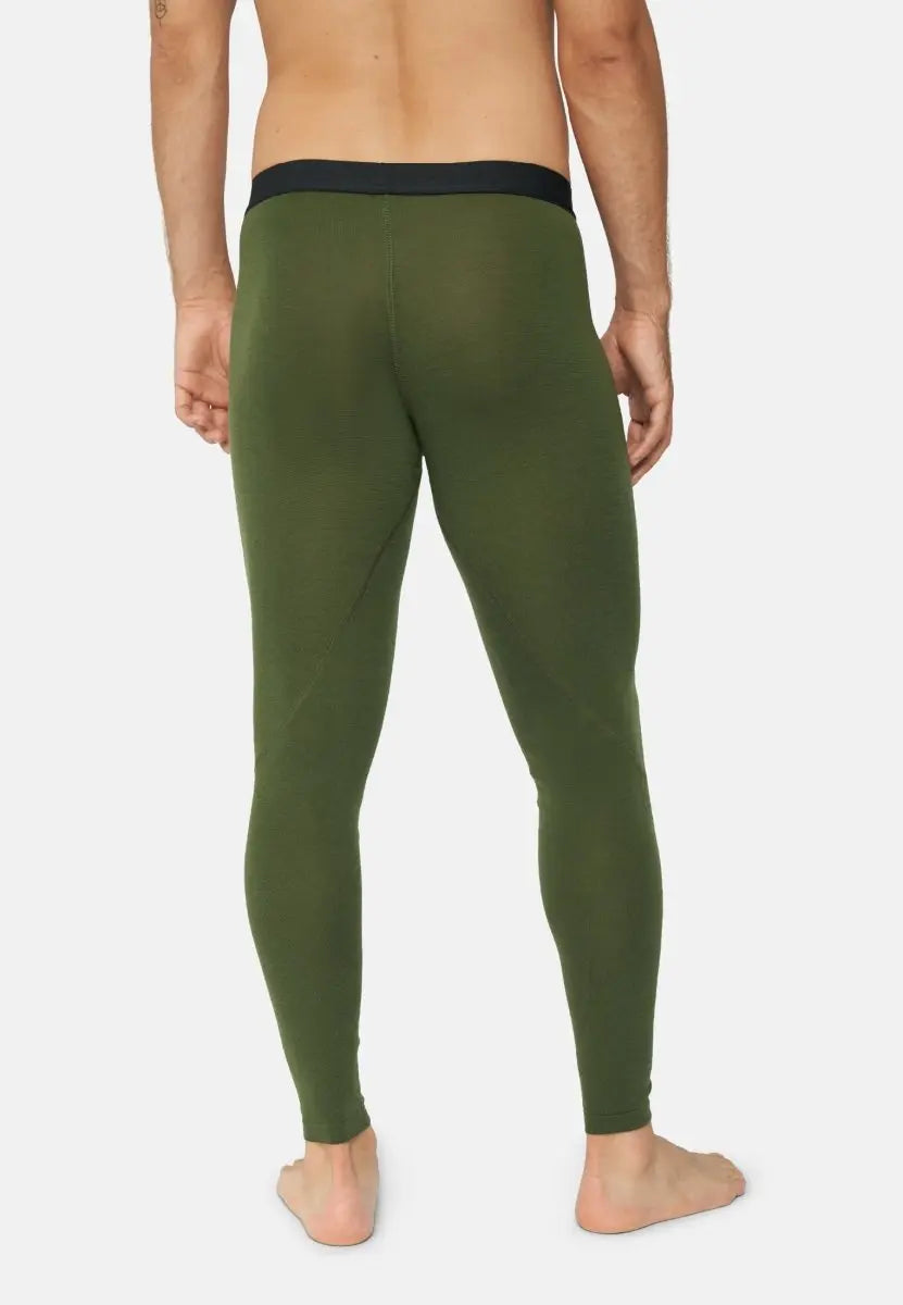 Back view of olive green merino wool base layer pants on a barefoot man.